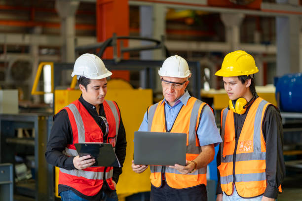 Team of diversity worker inspecting inside the steel manufacturing factory while listening to senior manager advice on improvement of capacity and productivity concept Team of diversity worker inspecting inside the steel manufacturing factory while listening to senior manager advice on improvement of capacity and productivity Equipment and Suppliers in construction  stock pictures, royalty-free photos & images