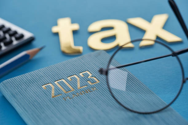 single word tax with 2023 calendar and calculator single word tax with 2023 calendar and calculator File Taxes stock pictures, royalty-free photos & images