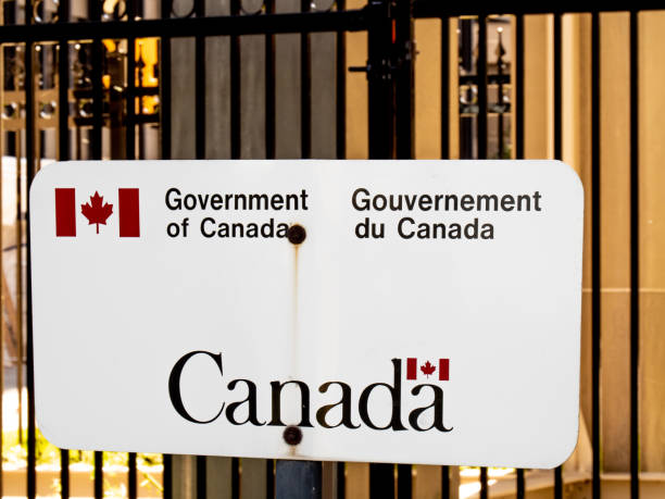 A generic English and French bilingual Government of Canada sign on a fence on Parliament Hill in Ottawa Ottawa, Canada; A Government of Canada sign in Ottawa Nigerian embassy in ottawa,CANADA stock pictures, royalty-free photos & images