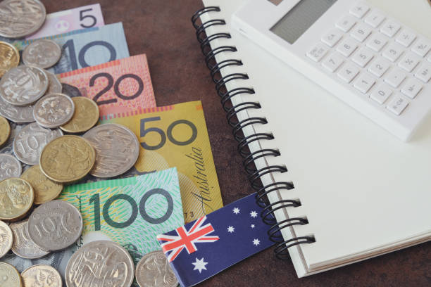 Australian money, AUD  calculator, and notebook Australian money, AUD  calculator, and notebook  Australia Taxation system stock pictures, royalty-free photos & images