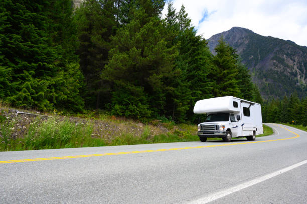 Motor home vacation in the mountains RV Road trip into the mountains. Summer vacations in a motorhome. Mobile Home Insurance stock pictures, royalty-free photos & images