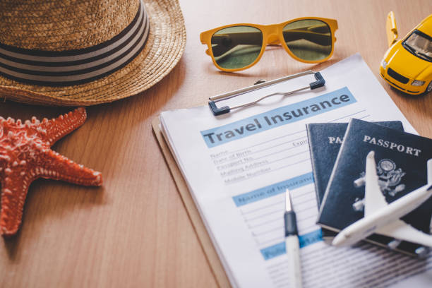 Travel insurance documents to help travelers feel confident in travel safety. Travel insurance documents to help travelers feel confident in travel safety. travel insurance stock pictures, royalty-free photos & images