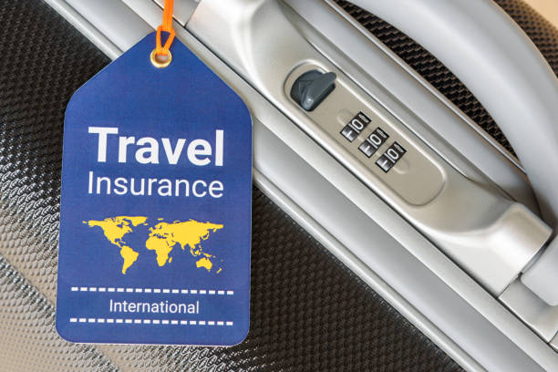 Travel safety and travel insurance concept : Travel insurance tag is hung near a numeric combination lock. Travel safety and travel insurance concept : Travel insurance tag is hung near a numeric combination lock. Travel insurance is intended to cover lost luggage, trip cancellation, accident, losses, etc travel insurance stock pictures, royalty-free photos & images